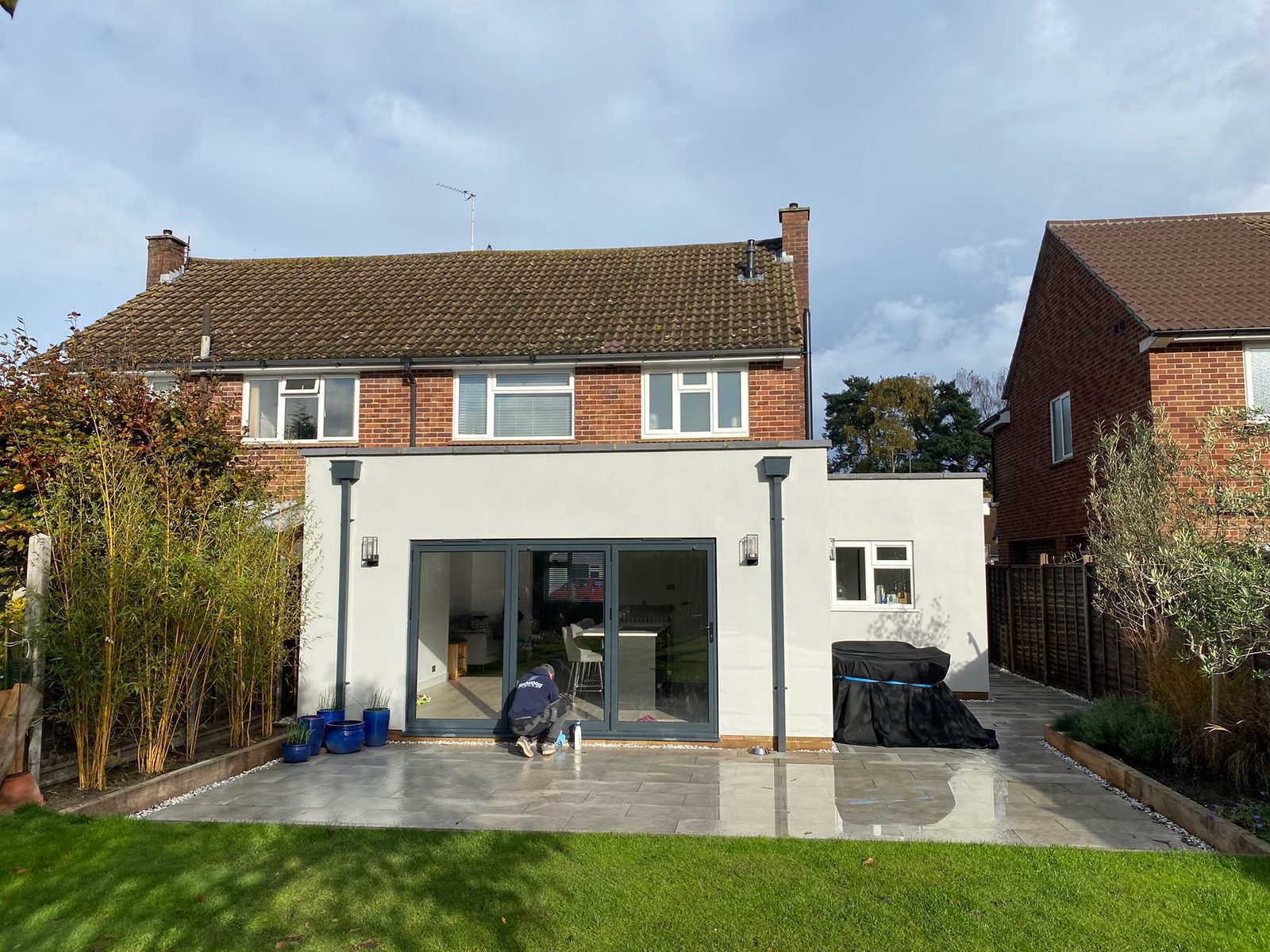 Completed rear extension with rendered finish and sliding doors