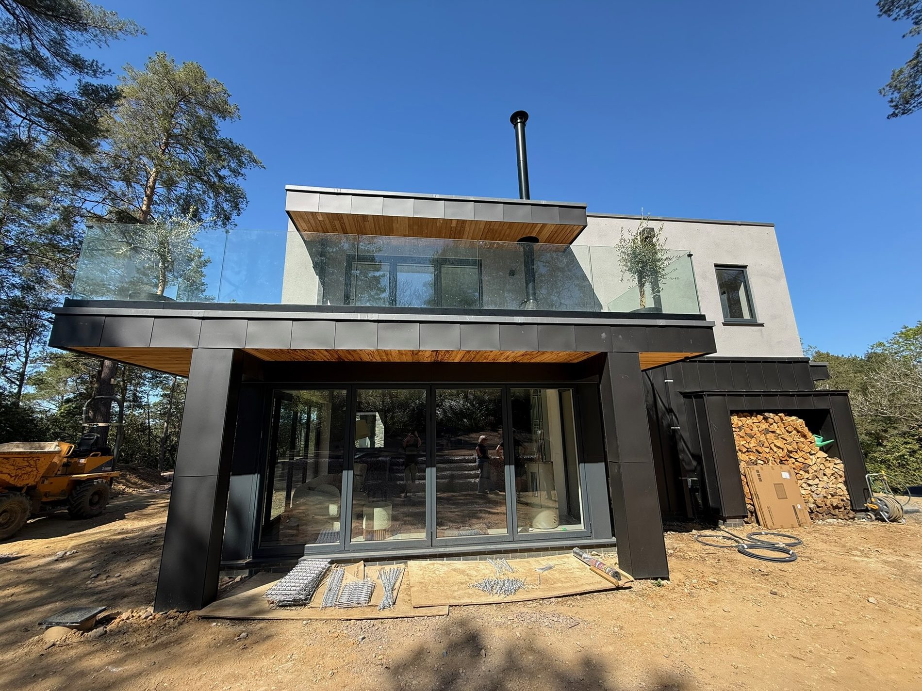 Contemporary new build home with zinc cladding and full-height glazing, Hampshire