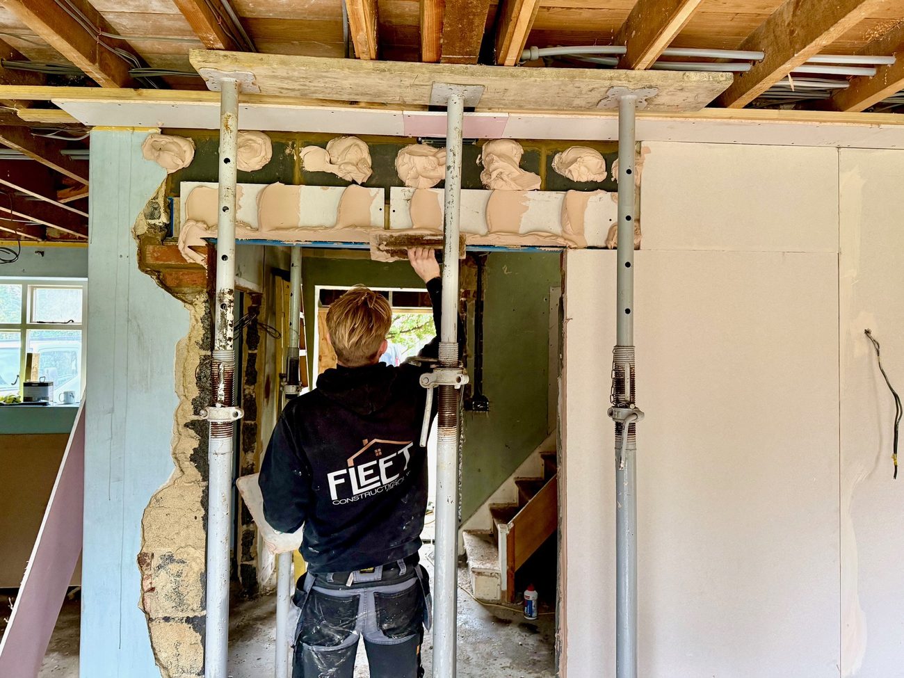 Structural opening being formed between two rooms