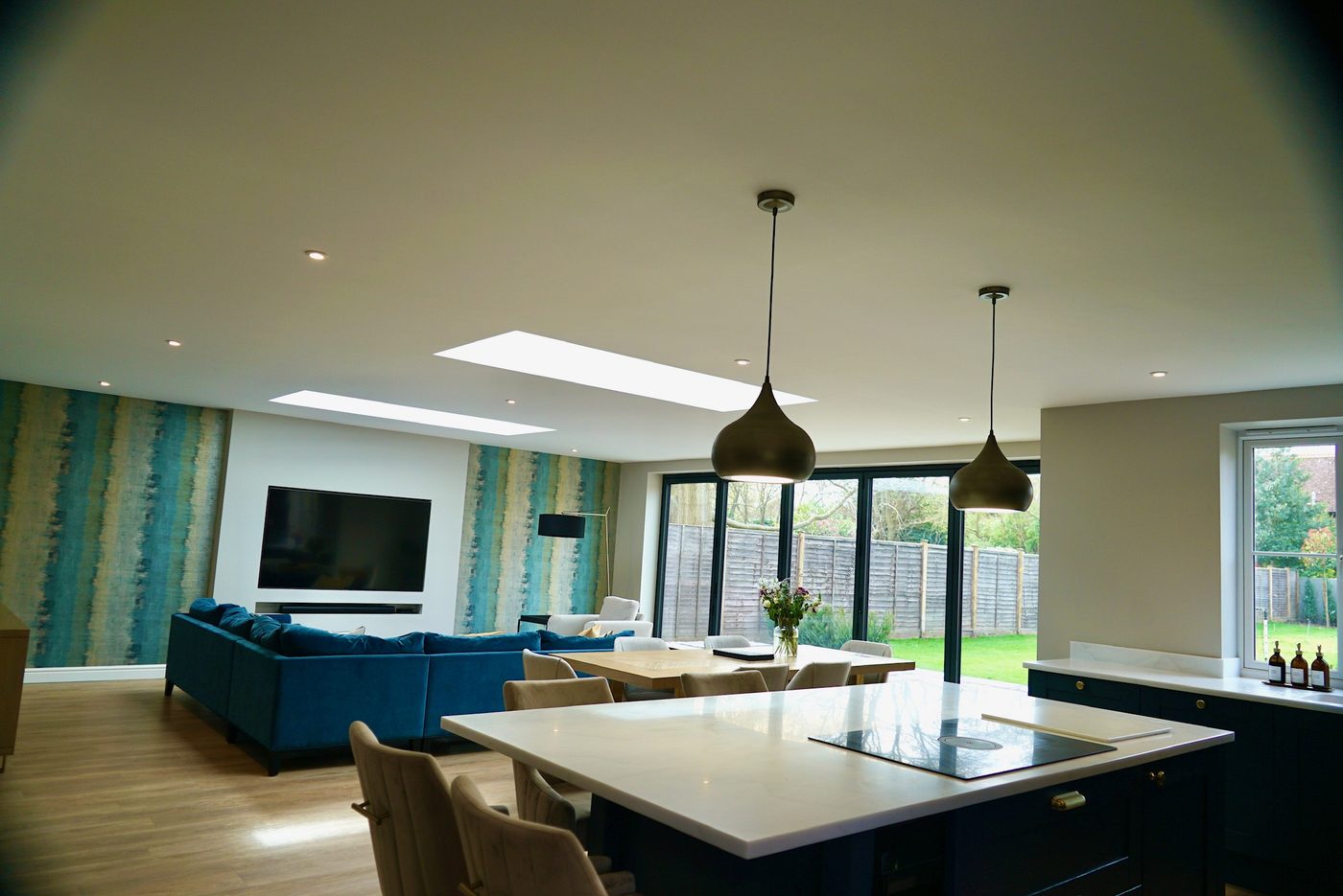 Open plan living space looking back towards the kitchen island