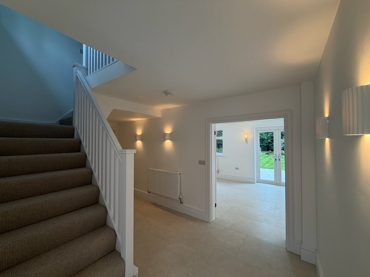 Landing and staircase with natural light from the hallway