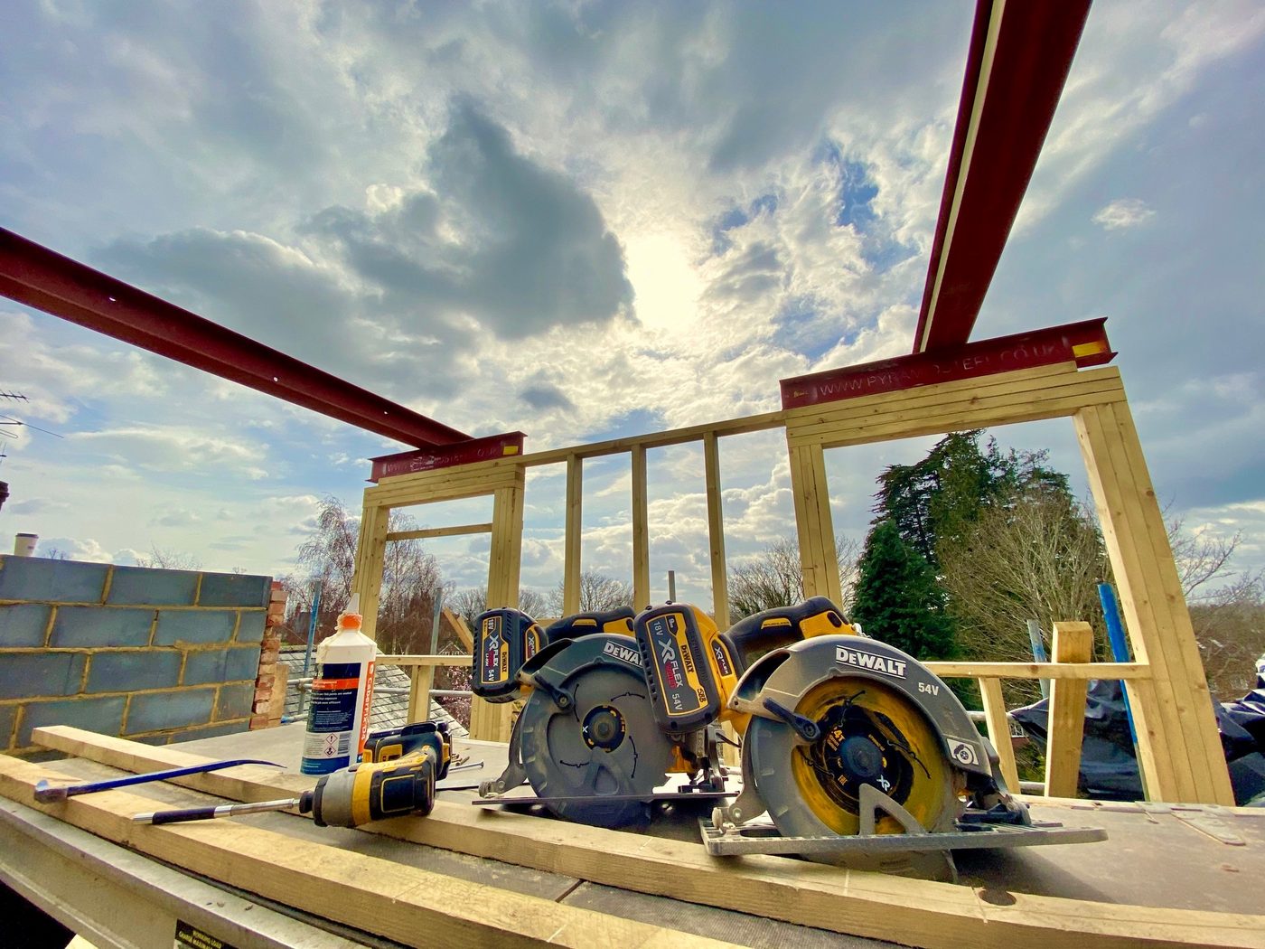 Oak framed structure and steel beams over a new garden room