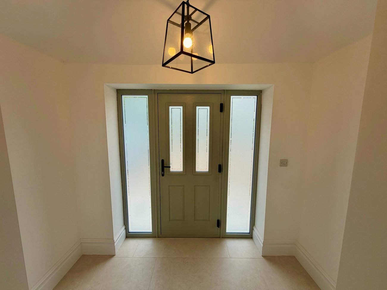 New front door and entrance hall with lantern pendant