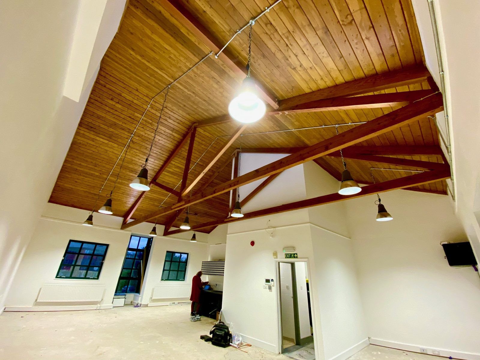 Large open interior with an exposed timber ceiling after fit out