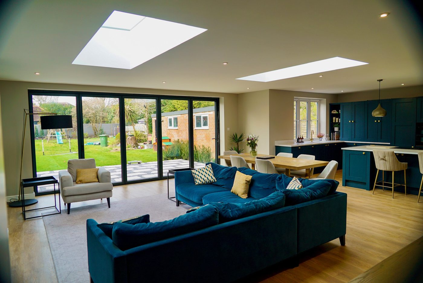 Open plan extension with roof lantern and bifold doors to the garden