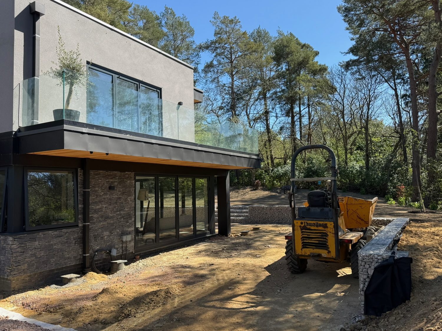 Front elevation of a contemporary new build with a cantilevered first floor