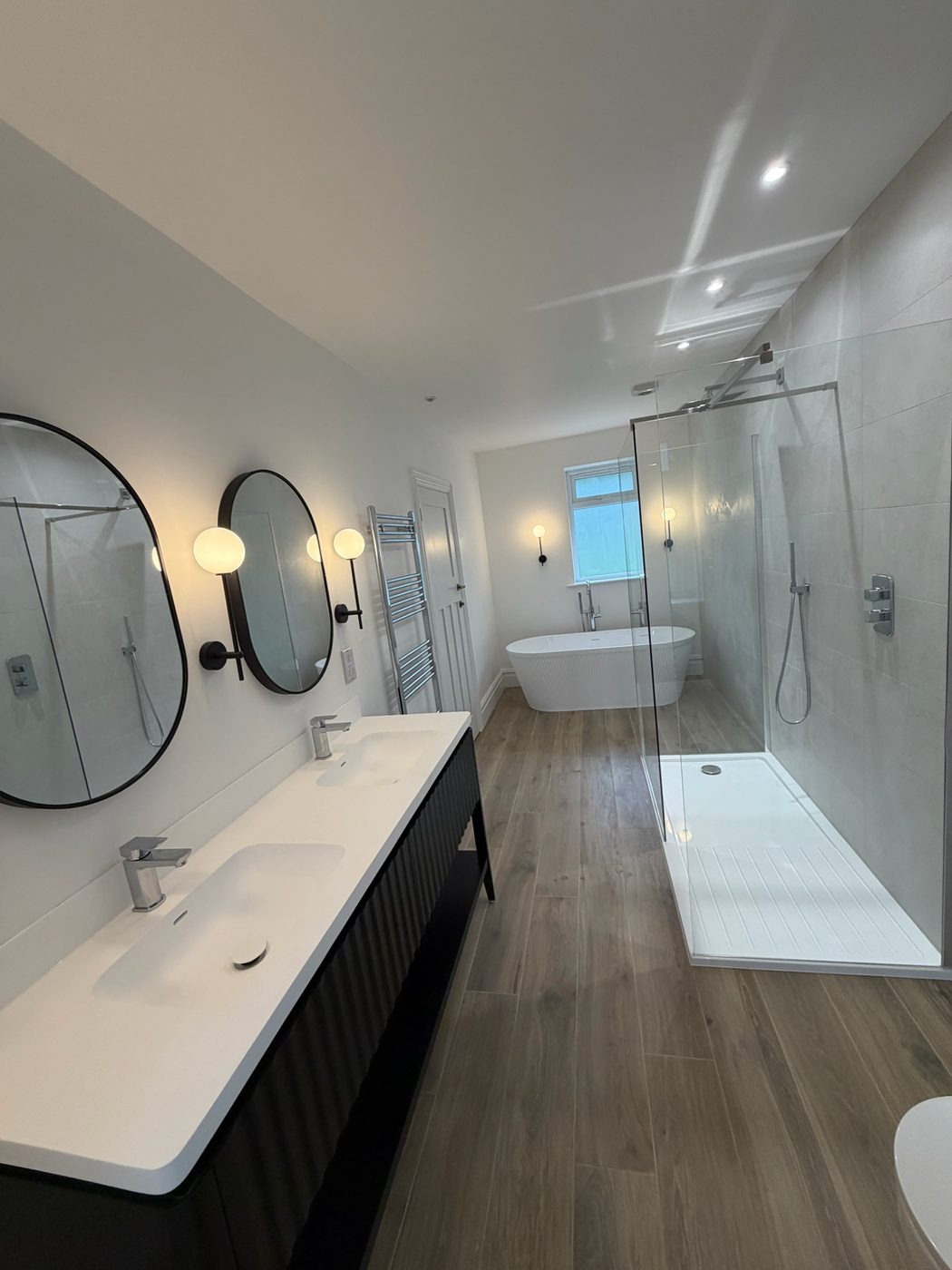 Bathroom with twin basins and a large walk-in shower